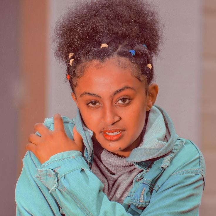 Kaveri Mehta, Lead Design Curator at Golden Peak Framework, reviewing corporate floral arrangements